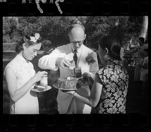 Hsiao Li Lindsay (李效黎) with Michael Lindsay (林迈可) being served cake, at their wedding party at Yenching University (燕京大學), Beijing (北京)