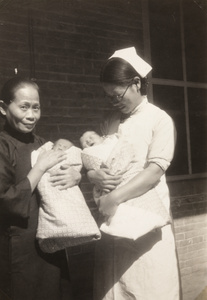 Baby twins with a nurse and another woman, Baoding
