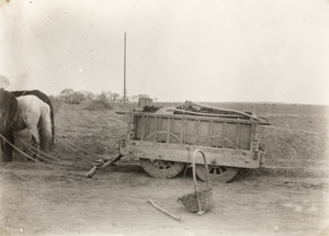 An old four-wheel horse drawn cart, being used to transport muck, near Beijing