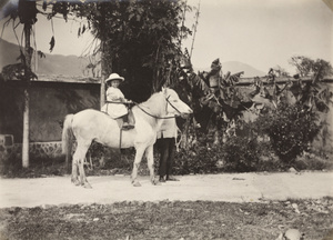 Marjorie Gordon Maxwell on a horse in a safety saddle, Yongchun