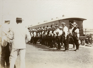 Allied soldiers at a railway station