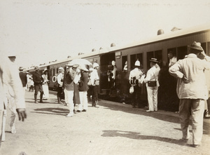 Soldiers and civilians at railway station