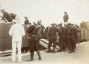 Gun on train, with allied soldiers