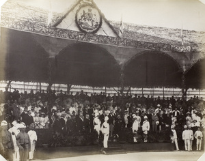 Spectators and dignitaries under a pavilion during the commemoration of Queen Victoria's Diamond Jubilee, Hong Kong, 1897