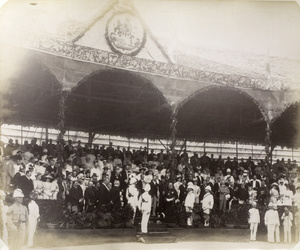 Spectators and dignitaries under a pavilion during the commemoration of Queen Victoria's Diamond Jubilee, Hong Kong, 1897