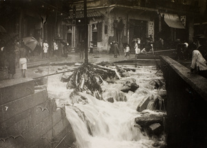 Flooding due to the 19th July 1926 rainstorm, at the stone nullah, Wan Chai (灣仔), Hong Kong