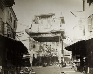 Close view of a decorative gateway on a Chinese street (possibly Queen's Road), Hong Kong, 1869