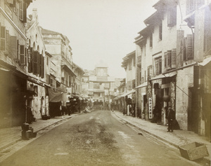 A Chinese street and decorative gateway, Hong Kong