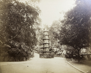 A pagoda in the middle of a road, possibly in Hong Kong Zoological and Botanical Gardens