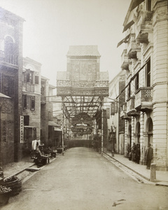 Decorative gate and canopy above a street in Hong Kong