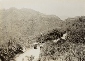 A sedan chair on a path beside a lamp post, Victoria Peak, Hong Kong