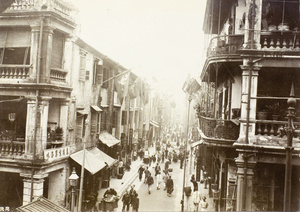 Busy street scene, decorated with flags, Hong Kong