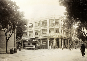 Tram turning at the intersection of Queen's Road East and Arsenal Street, Hong Kong