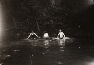 Oliver H. Hulme and other men in a pool