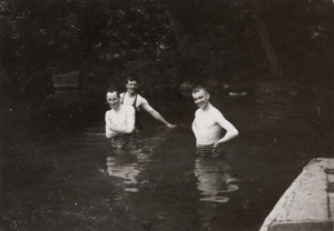 Oliver H. Hulme and two other men in a pool