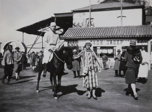 A woman leading a winning horse and jockey, Peking Races, Beijing