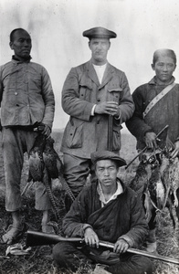 Oliver Heywood Hulme with Chinese servants and dead pheasants, near Anqing, 1916