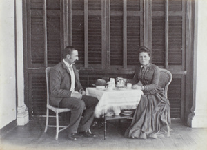 J.C. Oswald and Mrs. Woodley at afternoon tea