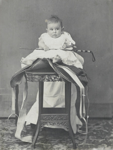 John Lee Guinness Oswald, posed on a saddle