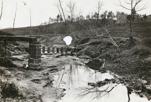 Bridge damaged by a torrent of water