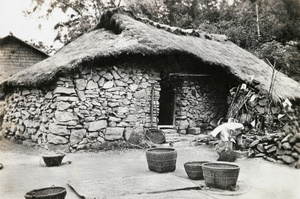 Farmhouse with threshing floor in front