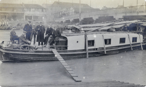 Men aboard the houseboat 'Patrol'