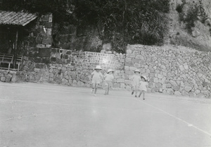 Pith helmeted children on a tennis court, Mokanshan Lodge