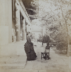 Lady Amelia Wade and Sir Thomas Francis Wade, with a library step chair, at the British Legation, Beijing