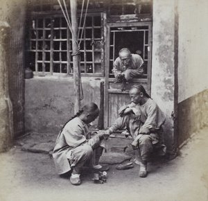An itinerant chiropodist operating on a corn, Beijing