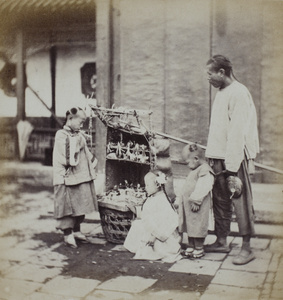An itinerant toy seller, with three children, Beijing