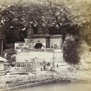 A man outside a building above a kiln by a pool