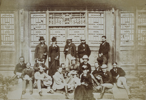A group of eighteen, including Sir Robert and Lady Hart, on the steps outside a temple or hall
