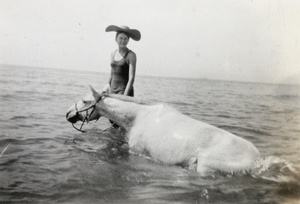 Mary Lampson with a horse in the sea, Beidaihe