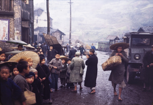 Children in street, with British vehicle, Chungking, 1945