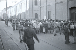 Refugees in French Concession, Shanghai, with soldiers
