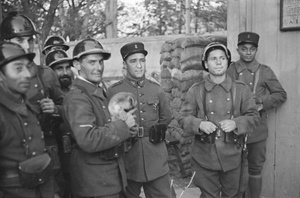 French army soldiers with a puppy
