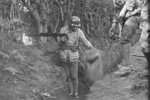 Nationalist soldiers in trench, with machine gun