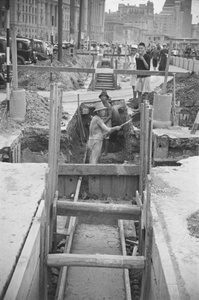 Workers digging trench, The Bund, Shanghai
