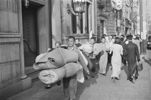 Displaced people carrying their worldly goods, Shanghai