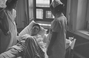 Nurses attending to patient, Shanghai