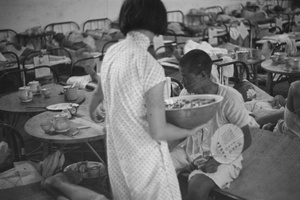 Serving food to a hospital patient, Shanghai