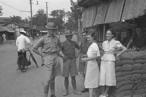Women and British soldiers chatting at a guard post, Shanghai