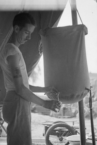 American Marine drawing water from canvas water bag, Shanghai