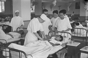 Doctors with patients in a hospital ward, Shanghai