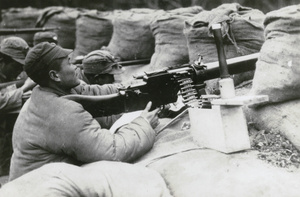 Chinese soldier with a machine gun