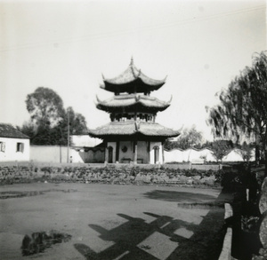 Small pagoda beside a pond