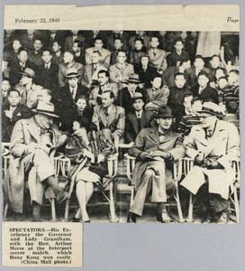 Sir Alexander Grantham and other spectators at a soccer match, 1948