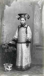 Studio portrait of a Manchu woman in fine traditional dress