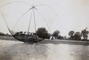 Drop net fishing in a river