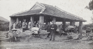Porters, wheelbarrows and sedan chairs, at a rest stop, near Chun Wan